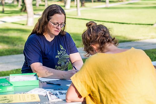 MIKAELA MACKENZIE / WINNIPEG FREE PRESS

Ariel Gordon (left) and Natalie Baird work on their ongoing draw/write project, the Pandemic Papers, at Vimy Ridge Park in Winnipeg on Tuesday, Aug. 18, 2020. For arts story.
Winnipeg Free Press 2020.