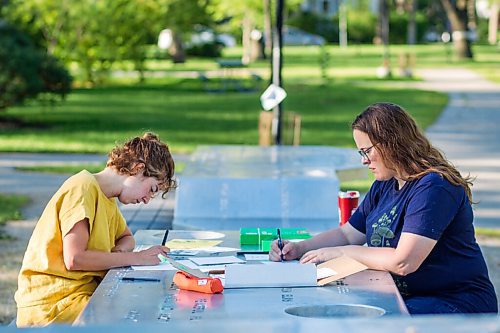 MIKAELA MACKENZIE / WINNIPEG FREE PRESS

Natalie Baird (left) and Ariel Gordon work on their ongoing draw/write project, the Pandemic Papers, at Vimy Ridge Park in Winnipeg on Tuesday, Aug. 18, 2020. For arts story.
Winnipeg Free Press 2020.