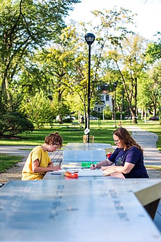 MIKAELA MACKENZIE / WINNIPEG FREE PRESS

Natalie Baird (left) and Ariel Gordon work on their ongoing draw/write project, the Pandemic Papers, at Vimy Ridge Park in Winnipeg on Tuesday, Aug. 18, 2020. For arts story.
Winnipeg Free Press 2020.