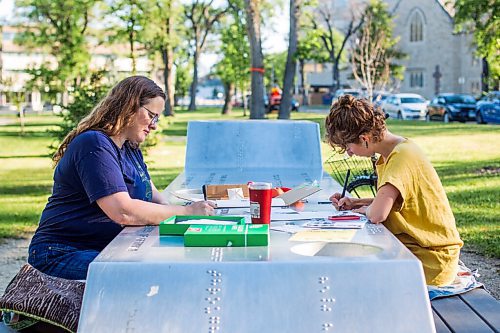 MIKAELA MACKENZIE / WINNIPEG FREE PRESS

Ariel Gordon (left) and Natalie Baird work on their ongoing draw/write project, the Pandemic Papers, at Vimy Ridge Park in Winnipeg on Tuesday, Aug. 18, 2020. For arts story.
Winnipeg Free Press 2020.