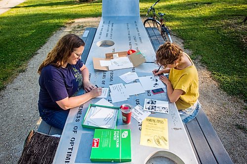 MIKAELA MACKENZIE / WINNIPEG FREE PRESS

Ariel Gordon (left) and Natalie Baird work on their ongoing draw/write project, the Pandemic Papers, at Vimy Ridge Park in Winnipeg on Tuesday, Aug. 18, 2020. For arts story.
Winnipeg Free Press 2020.