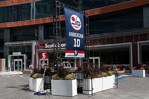 JESSE BOILY  / WINNIPEG FREE PRESS
The Dale Hawerchuk Memorial receives flowers and hockey sticks at True North Square on Wednesday. Wednesday, Aug. 19, 2020.
Reporter: