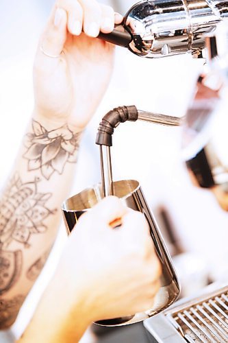 JOHN WOODS / WINNIPEG FREE PRESS
Rae de Sousa, manager at Harrisons Coffee Co., makes a latte at Al Dawsons new coffee shop and roaster on Waterfront Drive in Winnipeg Tuesday, August 19, 2020. 

Reporter: Durrani