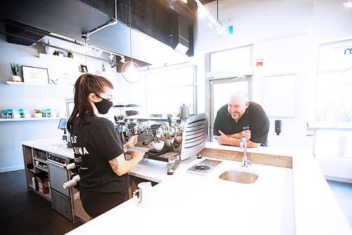 JOHN WOODS / WINNIPEG FREE PRESS
Owner Al Dawson jokes with Rae de Sousa, manager at Harrisons Coffee Co., as she makes a latte at Dawsons new coffee shop and roaster on Waterfront Drive in Winnipeg Tuesday, August 19, 2020. 

Reporter: Durrani
