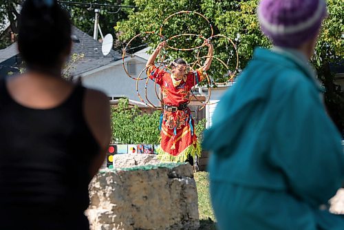 JESSE BOILY  / WINNIPEG FREE PRESS
Shanley Spence dances at the 1JustCity socially distanced Pow Wow during the lunch hour at Agnes Street and St Matthews on Thursday. Guests were asked to enjoy their lunches and watch in stead of joining in like previous years due to social distancing measures. Thursday, Aug. 20, 2020.
Reporter: Standup