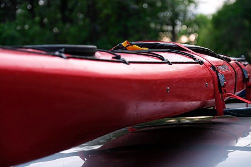 Daniel Crump / Winnipeg Free Press. A kayak belonging to a member of Experience Manitoba strapped atop a vehicle. August 20, 2020.