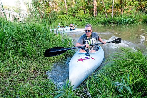 Daniel Crump / Winnipeg Free Press. Karen Enns runs her kayak aground after paddling the Seine river with Experience Manitoba, an outdoor group for women. August 20, 2020.
