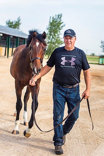 MIKAELA MACKENZIE / WINNIPEG FREE PRESS

Breeder Cam Ziprick poses for a photo with yearling Texas Mickey at the sale barns at the Assiniboia Downs in Winnipeg on Friday, Aug. 21, 2020. For George Williams story.
Winnipeg Free Press 2020.