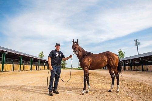 MIKAELA MACKENZIE / WINNIPEG FREE PRESS

Breeder Cam Ziprick poses for a photo with yearling Texas Mickey at the sale barns at the Assiniboia Downs in Winnipeg on Friday, Aug. 21, 2020. For George Williams story.
Winnipeg Free Press 2020.