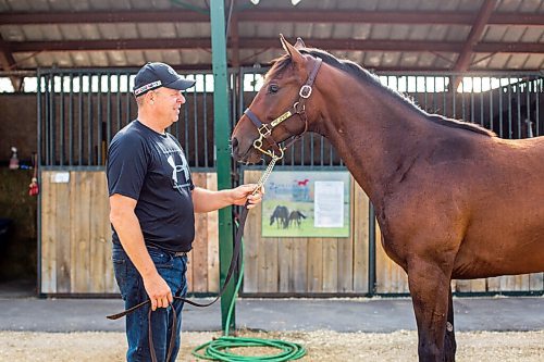 MIKAELA MACKENZIE / WINNIPEG FREE PRESS

Breeder Cam Ziprick poses for a photo with yearling Texas Mickey at the sale barns at the Assiniboia Downs in Winnipeg on Friday, Aug. 21, 2020. For George Williams story.
Winnipeg Free Press 2020.