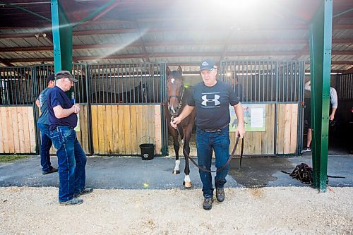 MIKAELA MACKENZIE / WINNIPEG FREE PRESS

Breeder Cam Ziprick poses for a photo with yearling Texas Mickey at the sale barns at the Assiniboia Downs in Winnipeg on Friday, Aug. 21, 2020. For George Williams story.
Winnipeg Free Press 2020.