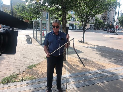 JOYANNE PURSAGA / Winnipeg Free Press
Coun. Ross Eadie (Mynarski) displays his broken cane to media on Friday, Aug. 21, 2020. Eadie, who is legally blind, is calling on cyclists to stop riding on busy sidewalks or at least slow down and be cautious near pedestrians after his cane was damaged in a collision with a cyclist on Aug. 20, 2020.
