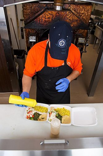 MIKE DEAL / WINNIPEG FREE PRESS
Baraka Pita at 1783 Main Street.
Hilal puts together a couple orders of Falafel for a customer.
see Alison Gillmor story
200824 - Monday, August 24, 2020.