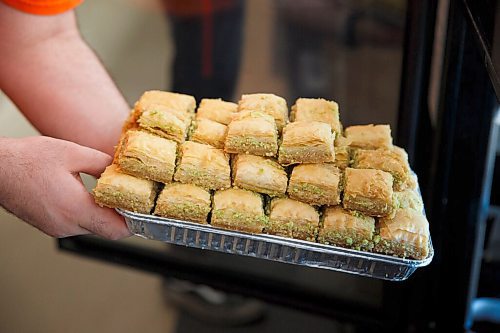 MIKE DEAL / WINNIPEG FREE PRESS
Baraka Pita at 1783 Main Street.
A tray of Baklava is put back in the display case.
see Alison Gillmor story
200824 - Monday, August 24, 2020.