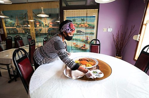 RUTH BONNEVILLE / WINNIPEG FREE PRESS

Sunnday Special - Harman's Cafe at 570 Sargent Ave

Photo of Harman's sampler platter which is a selection of traditional dishes served on Ethiopian flatbread made daily.

Also see photos of .Desta Worku Negatu preparing some Ethiopian favourites in the kitchen, shots of finished dishes in the restaurant (currently only open for pickup and takeout), exterior shots etc., for story. 

Description:
This is for a two-page Sunday Special on Harman's Cafe, an Ethiopian favourite in Winnipeg's West End. Owner, Desta Worku Negatu, has quite the story; she grew up in Ethiopia, escaped her homeland in '83 during the war at the age of 16 - 14 of 20 companions perished during the escape - and lived in Djibouti for three years, training to become a nurse. 
She moved to Canada in the late 90s to continue her studies but after popping into Harman's Cafe, a Portage Ave. lunch counter, one day for breakfast, she was hired to work there as a server, eventually taking over as manager. 
She opened a spot of her own in '09, dubbing it Harman's Cafe as a nod to her start in the biz. 
Reporter: Dave Sanderson

 Aug 25th, 2020