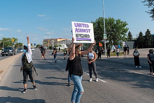 JESSE BOILY  / WINNIPEG FREE PRESS
Protestors briefly blocked traffic outside of Nygards Notre Dame property to bring awareness to what they say is Peter Nygards legacy of sexual abuse on Wednesday. Wednesday, Aug. 26, 2020.
Reporter: Malak