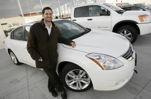 MIKE.DEAL@FREEPRESS.MB.CA 091119 - Thursday, November 19th, 2009 Auto - Sales Rep Matt Ostrove with the new 2010 Nissan Altima at Crown Nissan 700-1717 Waverley. MIKE DEAL / WINNIPEG FREE PRESS