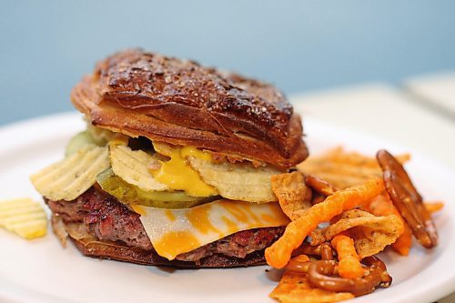 SHANNON VANRAES/WINNIPEG FREE PRESS
Chef Ashley Hebel prepares The Frenchway's Le Burger Week contender, the Manitoba Social, on Friday August 28, 2020.