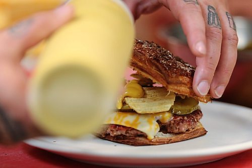 SHANNON VANRAES/WINNIPEG FREE PRESS
Chef Ashley Hebel prepares The Frenchway's Le Burger Week contender, the Manitoba Social, on Friday August 28, 2020.