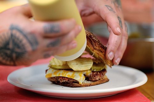 SHANNON VANRAES/WINNIPEG FREE PRESS
Chef Ashley Hebel prepares The Frenchway's Le Burger Week contender, the Manitoba Social, on Friday August 28, 2020.