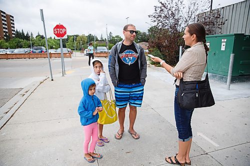 MIKE DEAL / WINNIPEG FREE PRESS
Chris Buffie and his children, Elena, 9, and Gabriella, 5, arrive at Pan Am Pool for their swimming lessons Friday morning.
The City of Winnipeg has had to cut down its recreation services this summer due to the pandemic, leaving Pan Am to be the only city pool offering swimming lessons right now.
See Joyanne Pursaga story
200828 - Friday, August 28, 2020.