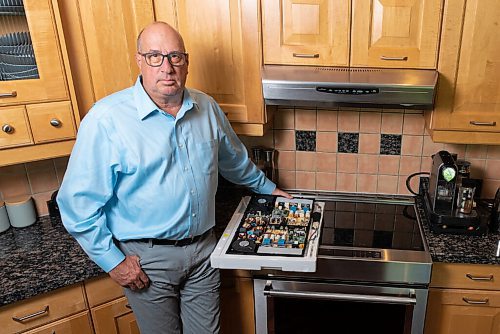 JESSE BOILY  / WINNIPEG FREE PRESS
Brian Hayward, who had some of his electronics and appliances break after a power surge in January 2019 is waiting on Manitoba Hydro to wrap its investigation to receive some compensation, shows the electrical board that broke on his stove at his home on Friday. Haywards stove was one of the appliances that were broken.  Friday, Aug. 28, 2020.
Reporter: Larry
