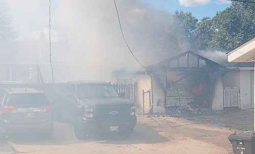 MIKE DEAL / WINNIPEG FREE PRESS
WFPS crews battle a garage fire at 366 Carpathia road which also destroyed a vehicle as well as damaged an adjacent garage Friday afternoon. No reports of injuries.
200828 - Friday, August 28, 2020.
