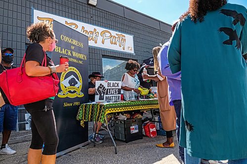 Daniel Crump / Winnipeg Free Press. Visitors check out vendors at the Black owned and run businesses block party. The block party is a collaboration between owners of Zueike Apparel, Ogo Okwumabua and Bryan Salvador, and the Black History Month Celebration Committee. August 29, 2020.
