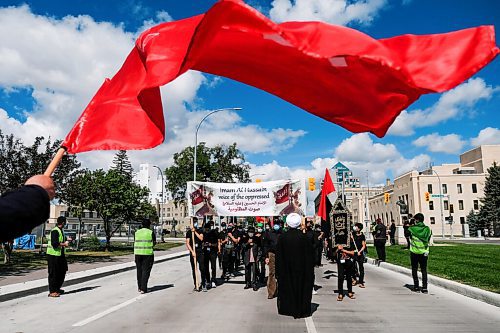 Daniel Crump / Winnipeg Free Press. Members of Winnipegs muslim community, lead by Dr. Zakaria Almoumen (right), march in commemoration of Imam Al Hussein. The march was also a protest against oppression. August 29, 2020.