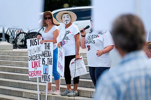 Daniel Crump / Winnipeg Free Press. Hugs over Masks pandemic deniers hold a protest at the Manitoba legislature. August 29, 2020.