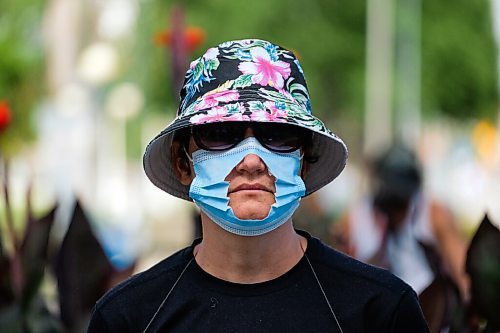 Daniel Crump / Winnipeg Free Press. An unidentified anti-mask protester wears a mask with a hole cut into it during a demonstration at the Manitoba legislature. August 29, 2020.