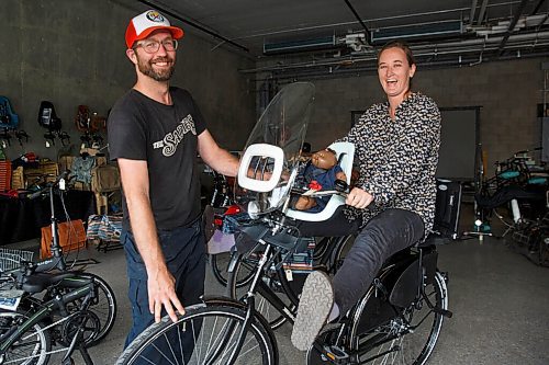 MIKE DEAL / WINNIPEG FREE PRESS
Anders Swanson, Executive Director of Winnipeg Trails and Leigh Anne Parry who runs Bicycle Garden at 267 Sherbrook with one of the Omfites or dutch bikes that have become popular. 
Spurred on by a local shortage in bikes and a renewed interest in cycling during the COVID-19 era, the Plain Bicycle Project and Winnipeg Trails have opened a pop-up cycle shop, Bicycle Garden, at 267 Sherbrook. The organizations shipped in six pallets of Dutch bikes and bike accessories, and the pop up has been popping.
200831 - Monday, August 31, 2020.
