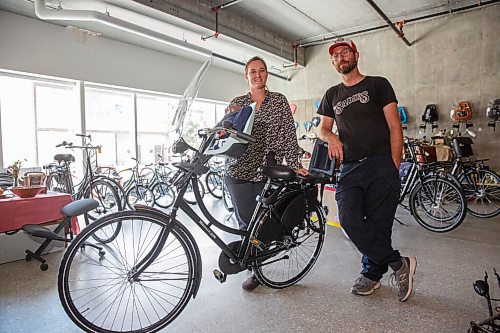 MIKE DEAL / WINNIPEG FREE PRESS
Anders Swanson, Executive Director of Winnipeg Trails and Leigh Anne Parry who runs Bicycle Garden at 267 Sherbrook with one of the Omfites or dutch bikes that have become popular. 
Spurred on by a local shortage in bikes and a renewed interest in cycling during the COVID-19 era, the Plain Bicycle Project and Winnipeg Trails have opened a pop-up cycle shop, Bicycle Garden, at 267 Sherbrook. The organizations shipped in six pallets of Dutch bikes and bike accessories, and the pop up has been popping.
200831 - Monday, August 31, 2020.