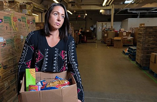 JESSE BOILY  / WINNIPEG FREE PRESS
Meaghan Erbus, advocacy and impact manager at Winnipeg Harvest, shows a hamper at the Winnipeg Harvest warehouse on Tuesday. Tuesday, Sept. 1, 2020.
Reporter: Temur