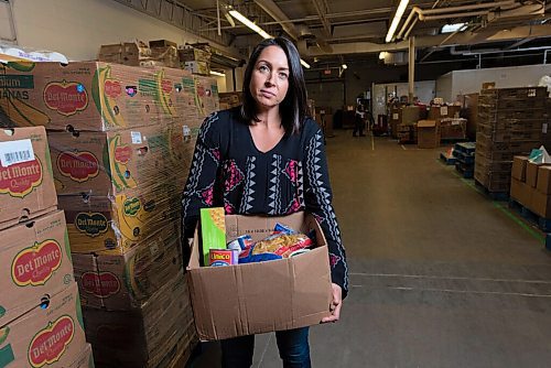 JESSE BOILY  / WINNIPEG FREE PRESS
Meaghan Erbus, advocacy and impact manager at Winnipeg Harvest, shows a hamper at the Winnipeg Harvest warehouse on Tuesday. Tuesday, Sept. 1, 2020.
Reporter: Temur