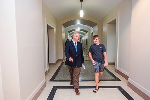 MIKAELA MACKENZIE / WINNIPEG FREE PRESS

Education minister Kelvin Goertzen and his 13-year-old son, Malachi, walk down the hallway at the Manitoba Legislative Building before the minister speaks to the media about the opening of schools next week in Winnipeg on Wednesday, Sept. 2, 2020. For Maggie Macintosh story.
Winnipeg Free Press 2020.