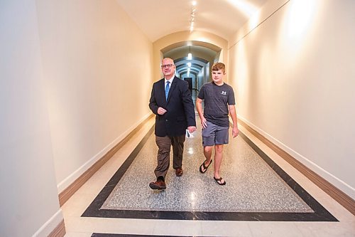 MIKAELA MACKENZIE / WINNIPEG FREE PRESS

Education minister Kelvin Goertzen and his 13-year-old son, Malachi, walk down the hallway at the Manitoba Legislative Building before the minister speaks to the media about the opening of schools next week in Winnipeg on Wednesday, Sept. 2, 2020. For Maggie Macintosh story.
Winnipeg Free Press 2020.