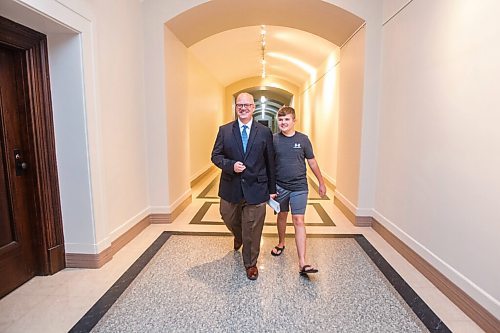 MIKAELA MACKENZIE / WINNIPEG FREE PRESS

Education minister Kelvin Goertzen and his 13-year-old son, Malachi, walk down the hallway at the Manitoba Legislative Building before the minister speaks to the media about the opening of schools next week in Winnipeg on Wednesday, Sept. 2, 2020. For Maggie Macintosh story.
Winnipeg Free Press 2020.