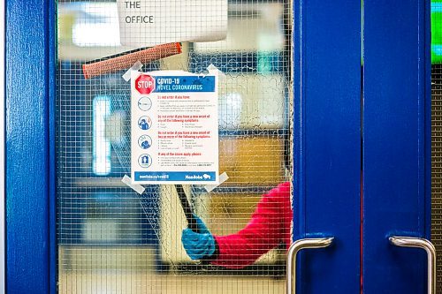 MIKAELA MACKENZIE / WINNIPEG FREE PRESS

Deborah Boateng, a cleaner at Churchill High School, cleans the entrance area at the school in Winnipeg on Wednesday, Sept. 2, 2020. For Maggie Macintosh story.
Winnipeg Free Press 2020.