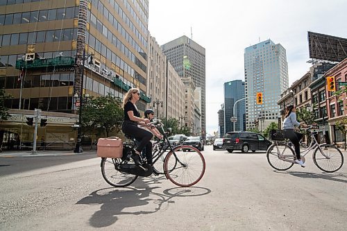 Mike Sudoma / Winnipeg Free Press
Cycling enthusiast, Erin Riedger rides across Main St while taking bike paths around downtown Winnipeg Wednesday afternoon.
September 2, 2020