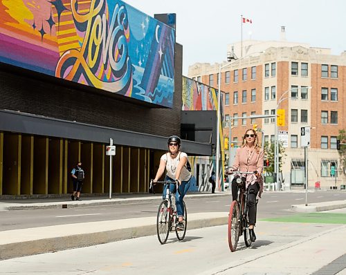 Mike Sudoma / Winnipeg Free Press
Cycling enthusiast, Erin Riedger (right) and Winnipeg Free Press reporter, Eva Wasney (left) rides their bikes down a bike path on Garry St while they take a ride around downtown Winnipeg Wednesday afternoon.
September 2, 2020