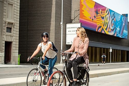 Mike Sudoma / Winnipeg Free Press
Cycling enthusiast, Erin Riedger (right) and Winnipeg Free Press reporter, Eva Wasney (left) rides their bikes down a bike path on Garry St while they take a ride around downtown Winnipeg Wednesday afternoon.
September 2, 2020