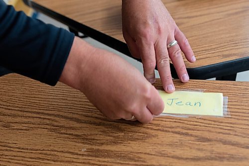 JESSE BOILY  / WINNIPEG FREE PRESS
A teacher tapes down a students name to their desk at Andrew Mynarski V.C. School on Wednesday. Wednesday, Sept. 2, 2020.
Reporter: