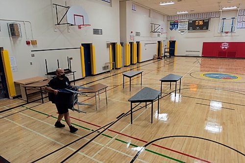 JESSE BOILY  / WINNIPEG FREE PRESS
Teachers move tables and chairs into the gym as they turn it into a classroom at Andrew Mynarski V.C. School on Wednesday. Wednesday, Sept. 2, 2020.
Reporter: