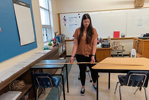 JESSE BOILY  / WINNIPEG FREE PRESS
Taylor Marks, a grade 8 math teacher, shows how she measured out her desks in her classroom at Andrew Mynarski V.C. School on Wednesday. Wednesday, Sept. 2, 2020.
Reporter:
