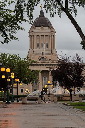 JESSE BOILY  / WINNIPEG FREE PRESS
A person walks past the Legislative building in the rain on Wednesday. Wednesday, Sept. 2, 2020.
Reporter: Standup