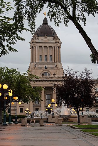 JESSE BOILY  / WINNIPEG FREE PRESS
A person walks past the Legislative building in the rain on Wednesday. Wednesday, Sept. 2, 2020.
Reporter: Standup