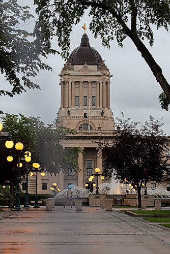 JESSE BOILY  / WINNIPEG FREE PRESS
A person walks past the Legislative building in the rain on Wednesday. Wednesday, Sept. 2, 2020.
Reporter: Standup