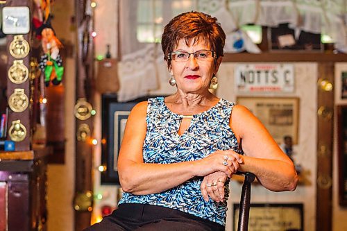 MIKAELA MACKENZIE / WINNIPEG FREE PRESS

Travel agent Christine Ward poses for a portrait in the British pub in her basement (where she often brings clients for meetings) in Winnipeg on Thursday, Sept. 3, 2020. She's been running her otherwise thriving business at a loss because of COVID-19. For Temur story.
Winnipeg Free Press 2020.