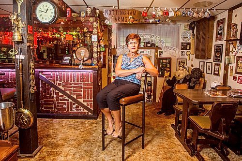 MIKAELA MACKENZIE / WINNIPEG FREE PRESS

Travel agent Christine Ward poses for a portrait in the British pub in her basement (where she often brings clients for meetings) in Winnipeg on Thursday, Sept. 3, 2020. She's been running her otherwise thriving business at a loss because of COVID-19. For Temur story.
Winnipeg Free Press 2020.